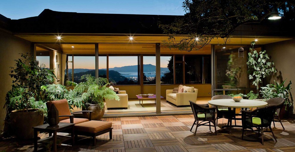 Patio - large contemporary courtyard patio idea in San Francisco with decking and no cover