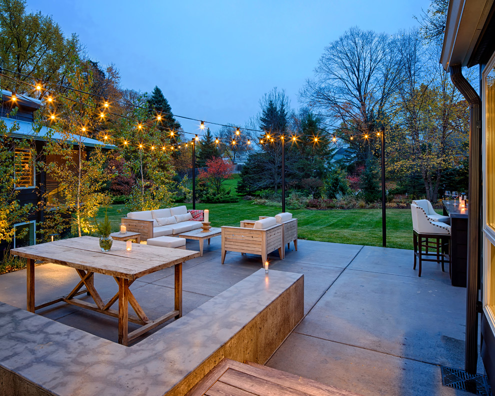 Example of a trendy covered patio design in Minneapolis