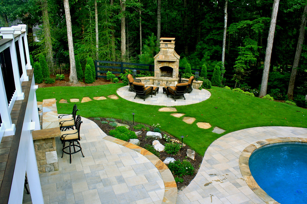 Mid-sized elegant backyard concrete paver patio photo in Atlanta with no cover