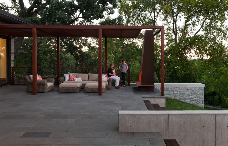 Mid-sized trendy backyard concrete paver patio photo in Minneapolis with a pergola and a fire pit