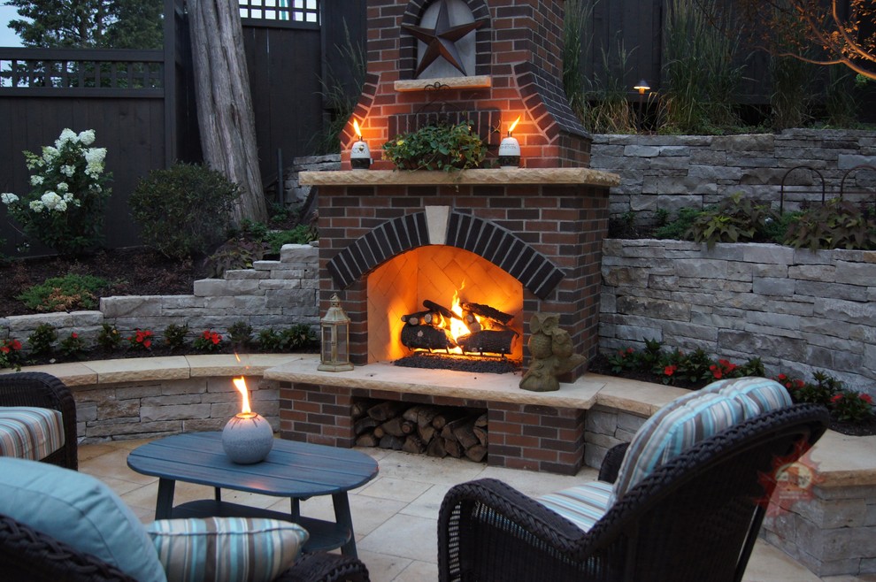 Inspiration for a large timeless backyard concrete paver patio remodel in Minneapolis with no cover