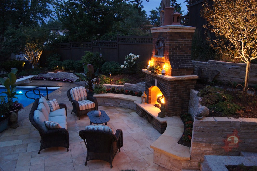 Inspiration for a large timeless backyard concrete paver patio remodel in Minneapolis with a gazebo