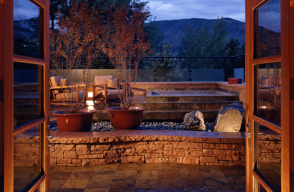 Inspiration for a rustic patio in Denver with no cover and fencing.