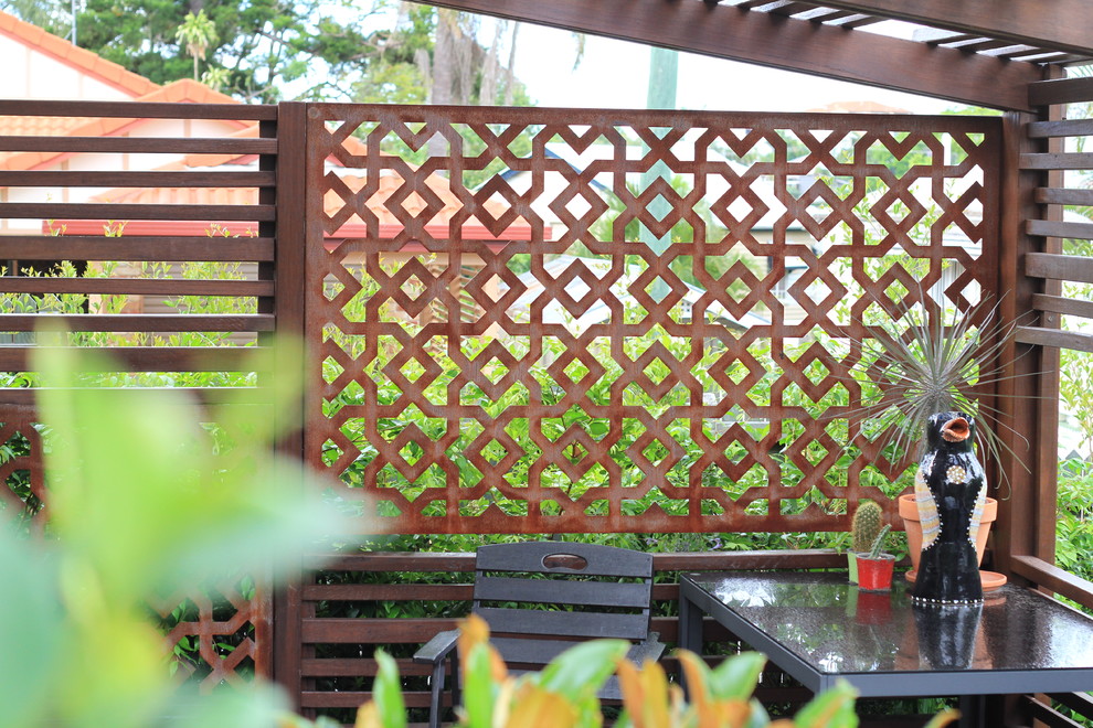 Immagine di un patio o portico boho chic di medie dimensioni e dietro casa