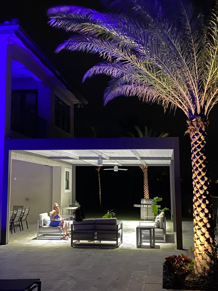 Patio - mid-sized modern backyard patio idea with a pergola