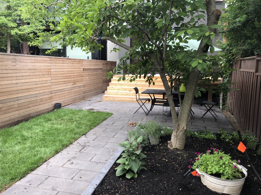 Modern Backyard Patio with Cedar Deck and Stone Patio in Toronto