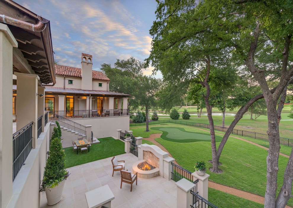 Patio - mediterranean patio idea in Dallas with a fire pit