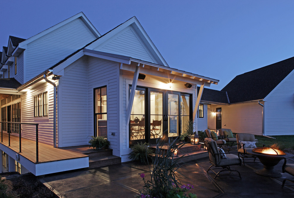 Elegant patio photo in Omaha with a fire pit
