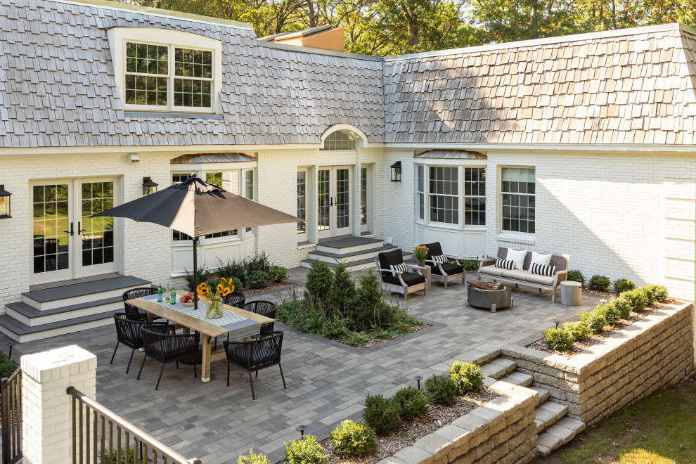 Inspiration for a large classic courtyard patio in Minneapolis with concrete paving and no cover.