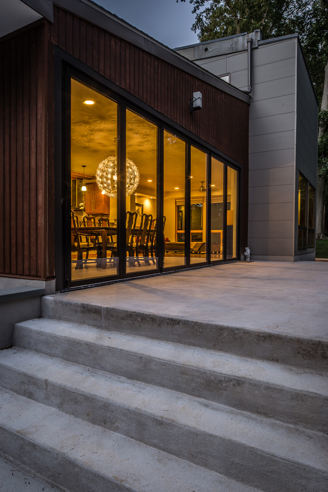 Example of a mid-sized minimalist backyard concrete patio design in Philadelphia with no cover