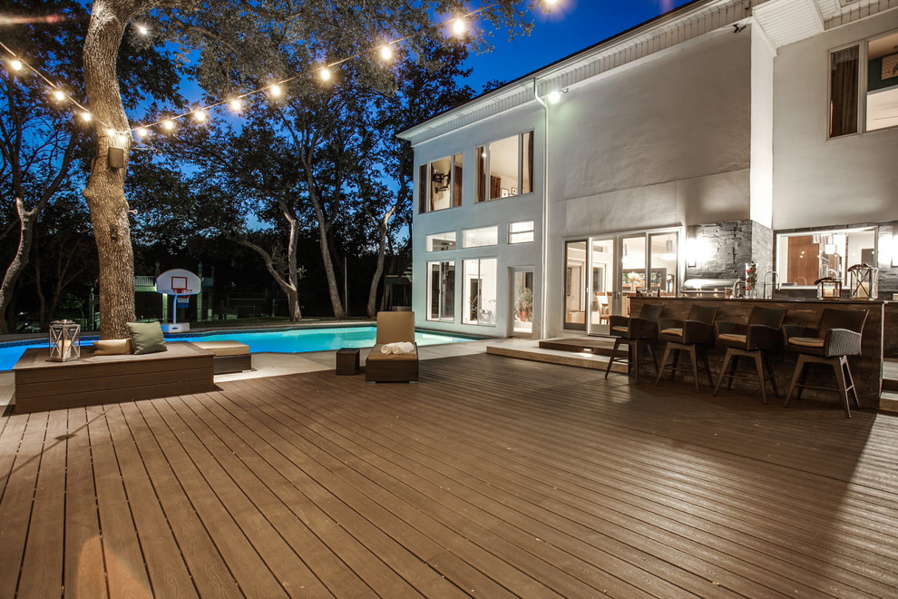 Inspiration for a modern back patio in Dallas with an outdoor kitchen and decking.