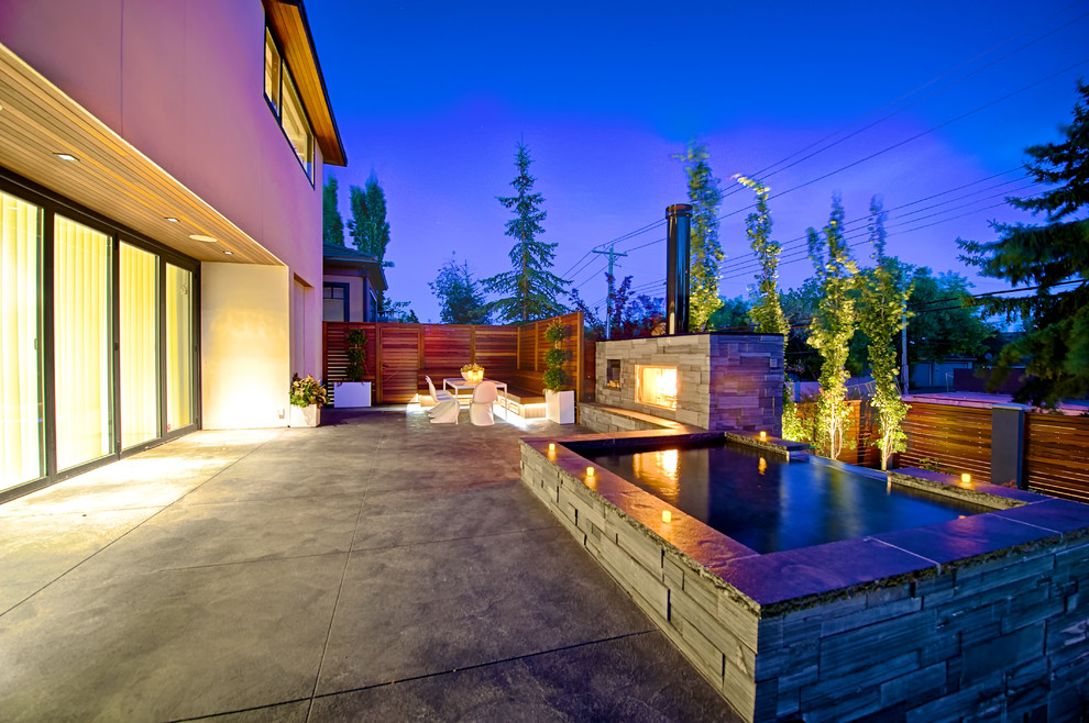 Medium sized modern back patio in Calgary with no cover.