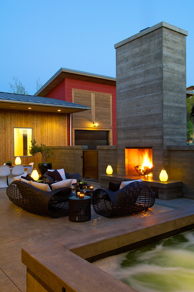 Example of a trendy patio design in Other with a fire pit