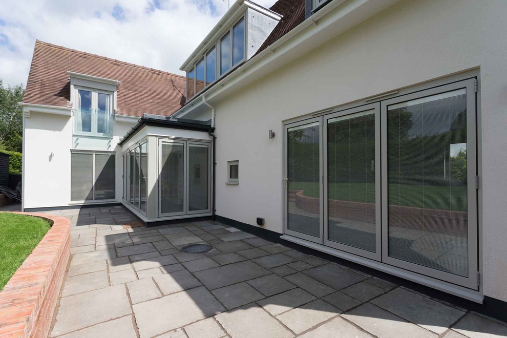 Patio - mid-sized contemporary backyard patio idea in West Midlands