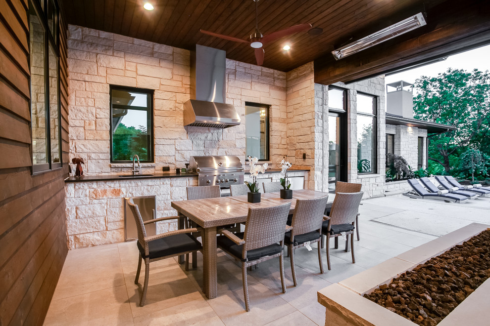 Example of a large trendy backyard concrete patio kitchen design in Dallas with a roof extension