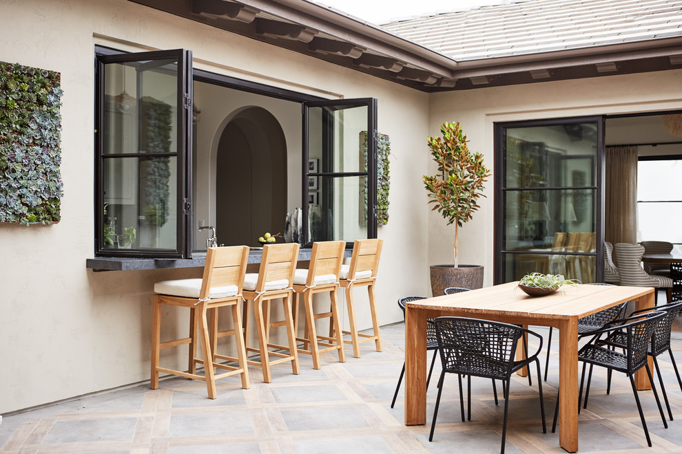 Design ideas for a medium sized mediterranean courtyard patio in San Francisco with a roof extension.