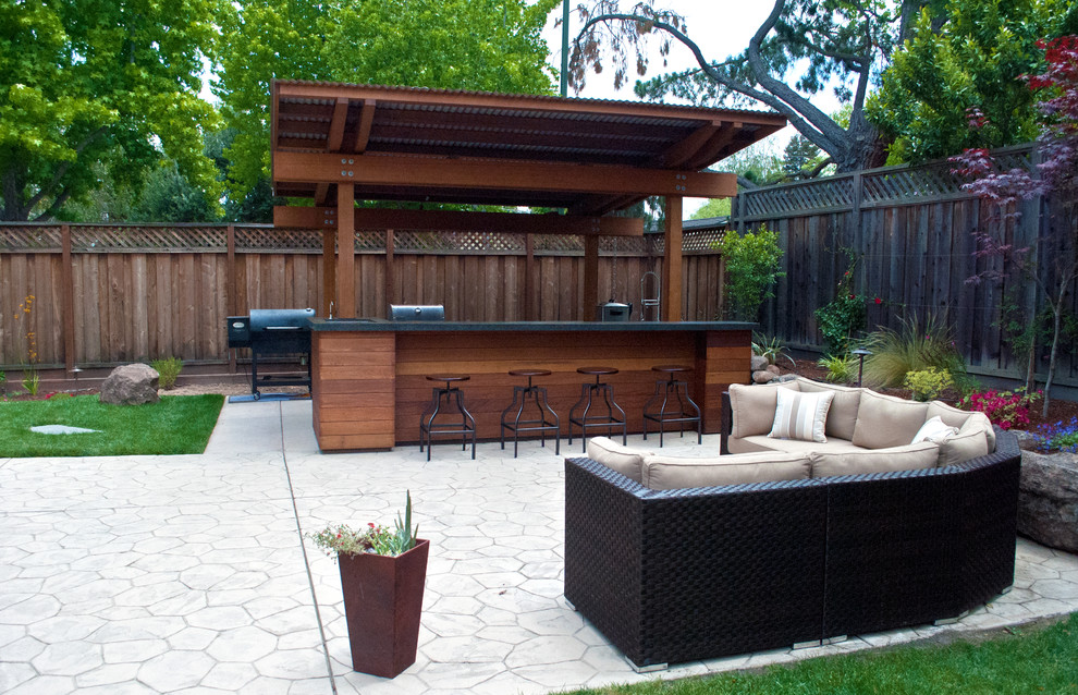 Inspiration for a small contemporary backyard stamped concrete patio remodel in San Francisco