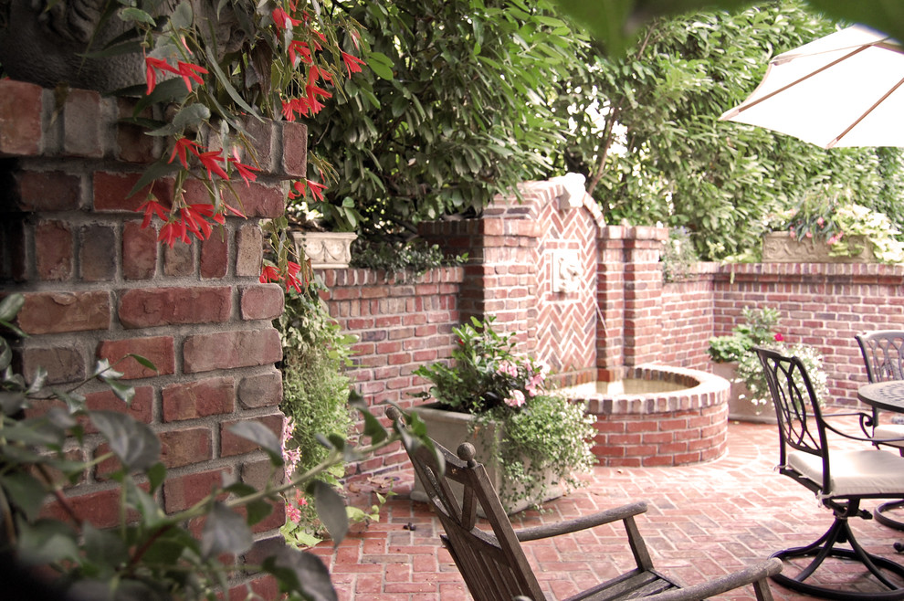 Inspiration for a small classic side patio in Portland with brick paving.