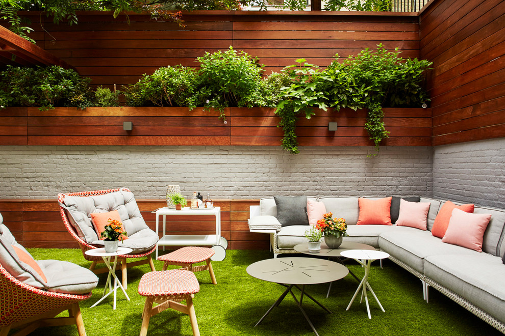 Contemporary back patio in New York with a potted garden and no cover.