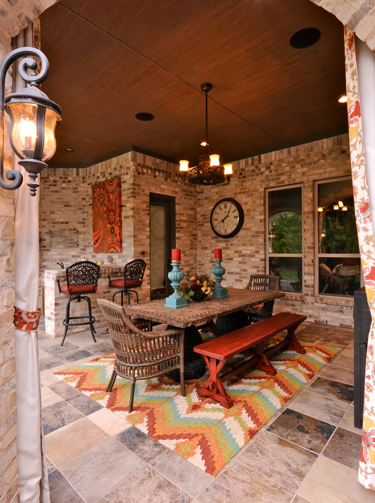 Inspiration for a timeless patio remodel in Dallas with a roof extension