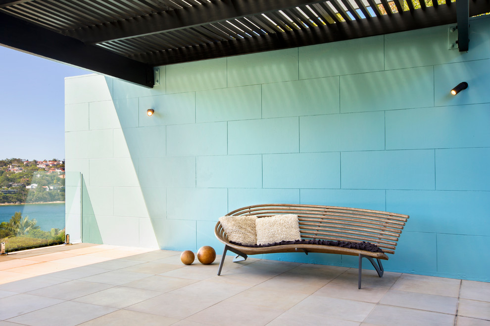 Inspiration for a contemporary courtyard patio in Sydney with a pergola.