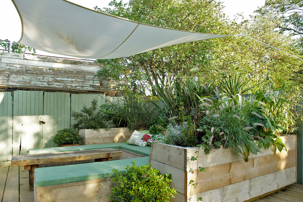 This is an example of a shabby-chic style patio in London.