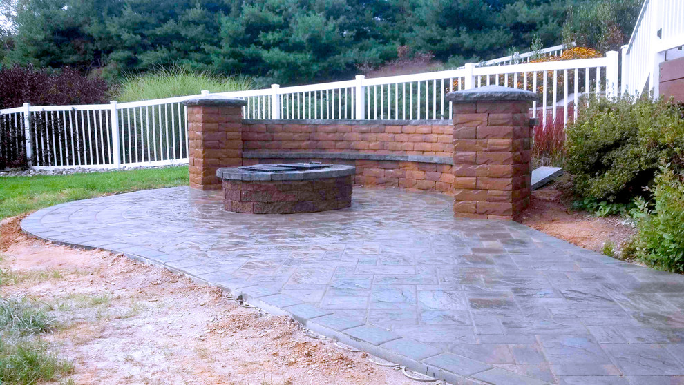 Inspiration for a classic back patio in DC Metro with a fire feature and concrete paving.