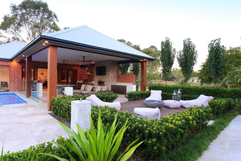 This is an example of a large contemporary back patio in Sydney with a vegetable patch and a roof extension.