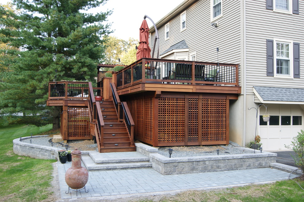 Example of a large classic courtyard concrete paver patio container garden design in New York