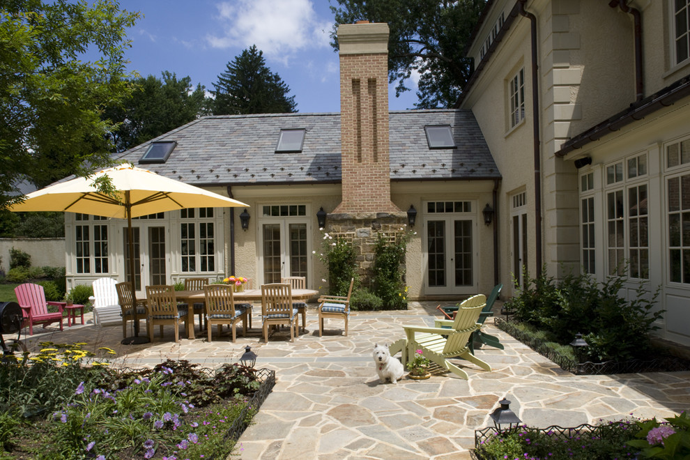Elegant stone patio photo in Baltimore with no cover