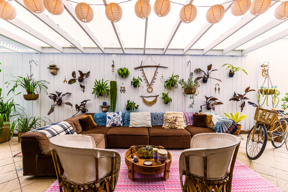 Beach style courtyard patio photo in Los Angeles with a pergola