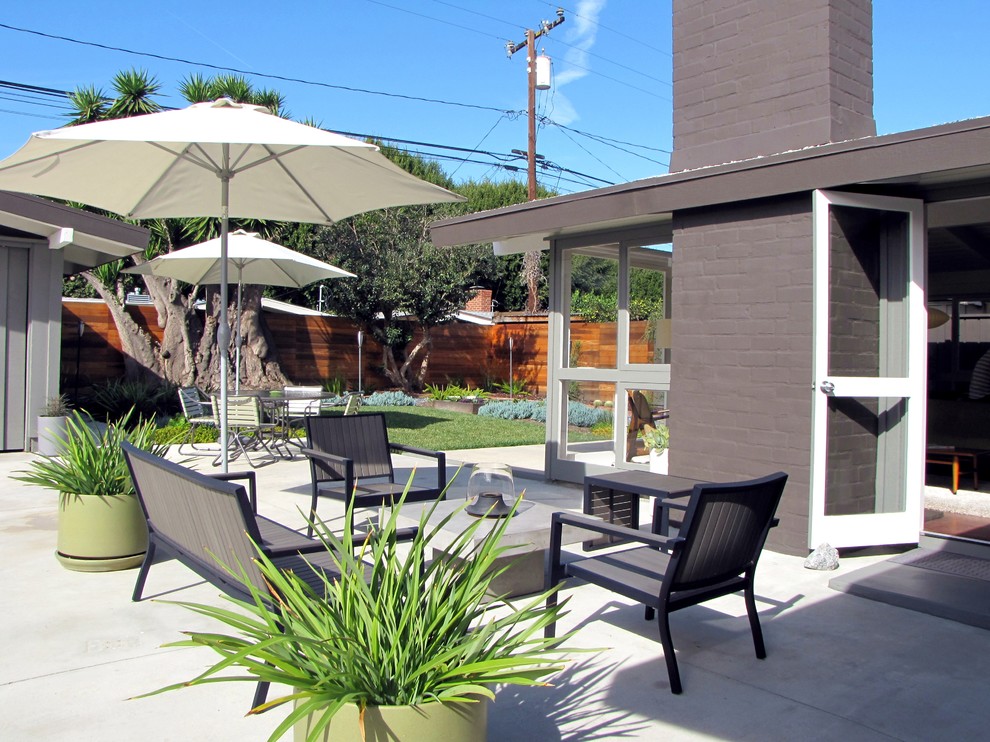 Inspiration for a 1960s patio remodel in Orange County with no cover