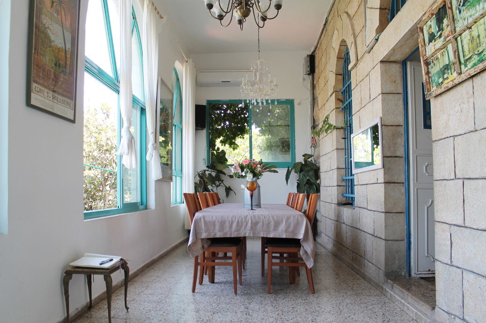 Example of a tuscan dining room design in Tel Aviv