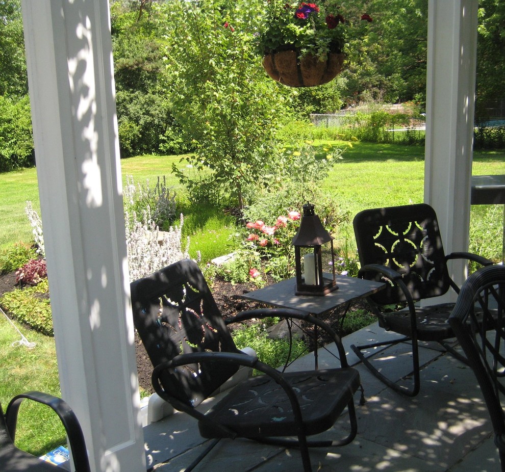 Example of a country patio design in Boston