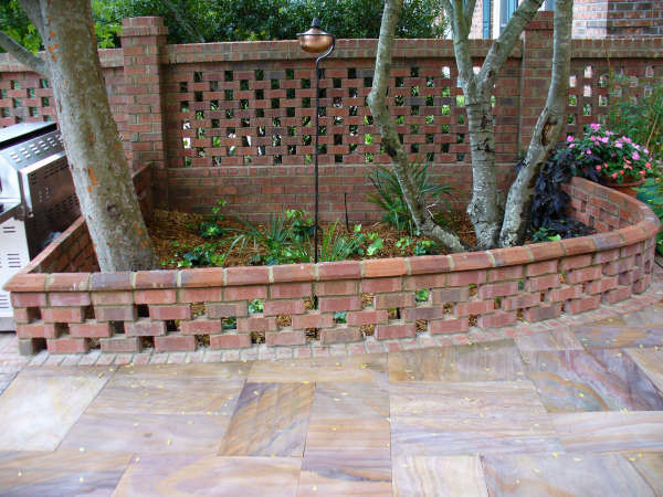 Large elegant backyard stone patio photo in Charleston with no cover