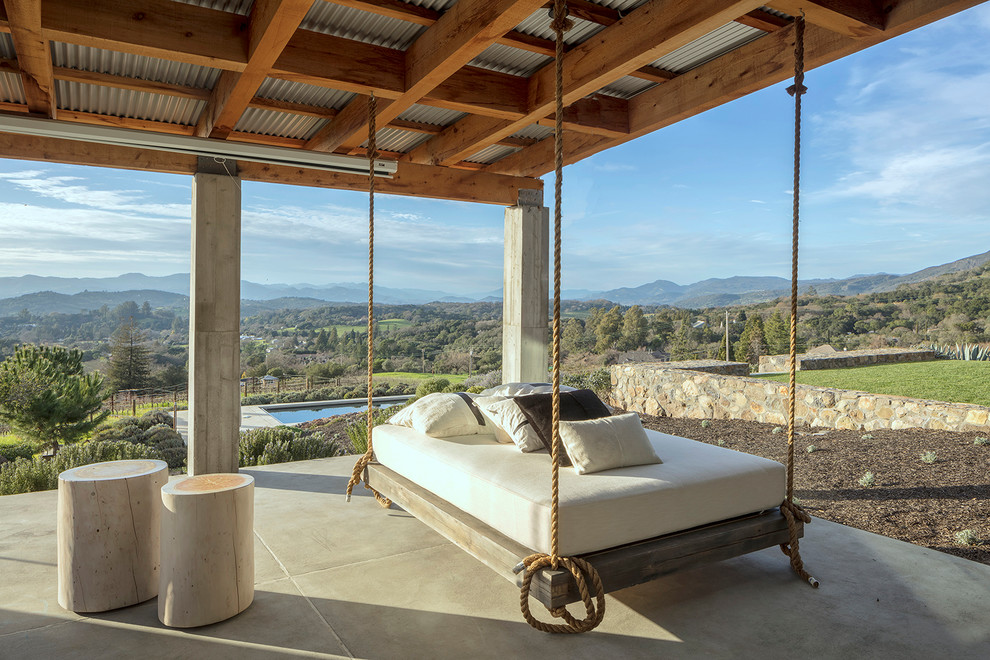Patio - mediterranean patio idea in San Francisco with a roof extension