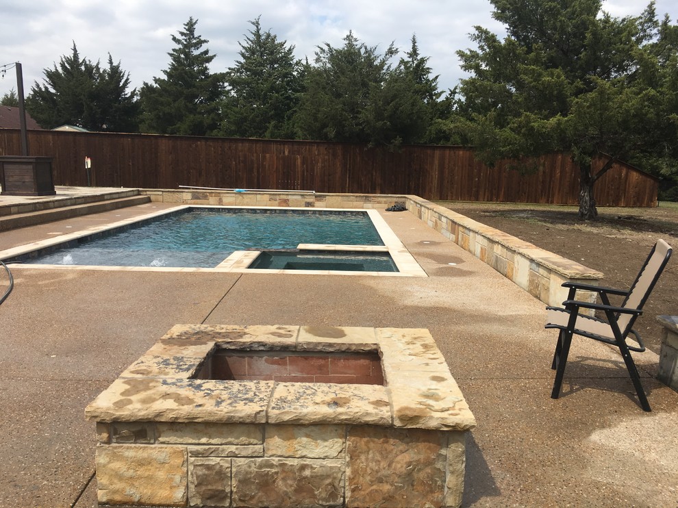Example of a mid-sized classic backyard patio design in Dallas with a fire pit, decking and no cover