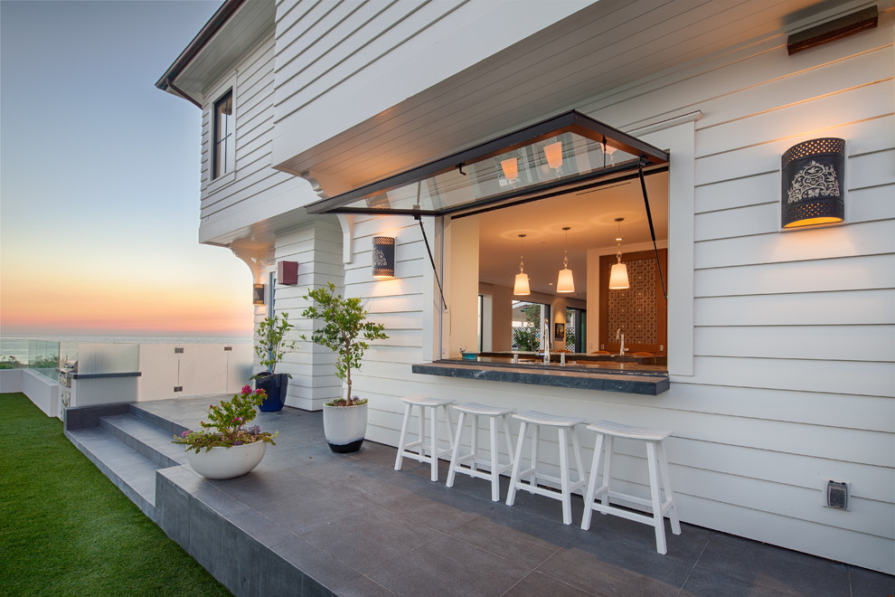 Patio - coastal backyard patio idea in San Diego