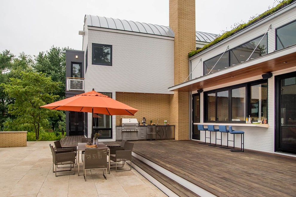 Example of a mid-sized urban backyard patio design in Chicago