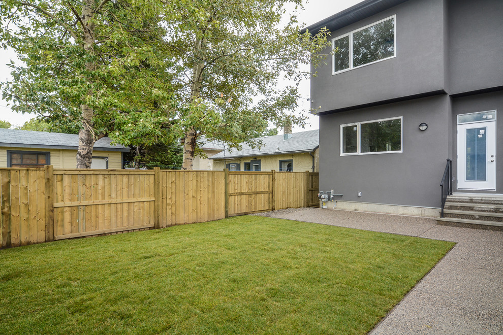 Patio - mid-sized contemporary backyard decomposed granite patio idea in Calgary with no cover