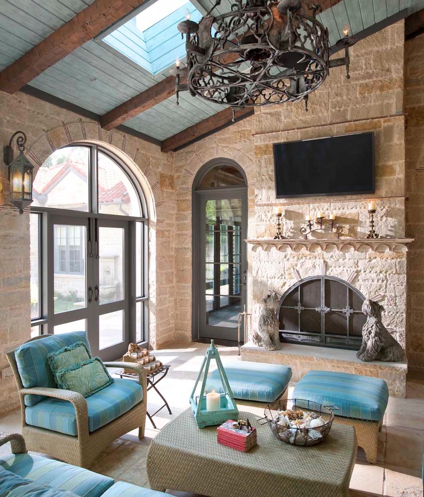 Design ideas for a mediterranean patio in Dallas with a fire feature and a roof extension.