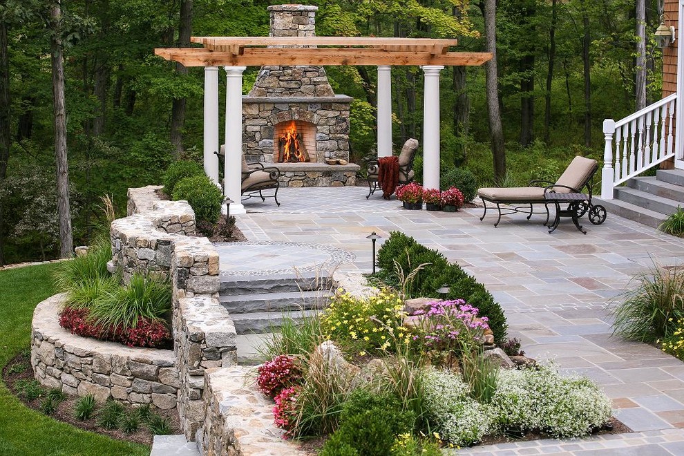 Photo of a traditional patio in New York with a fire feature.