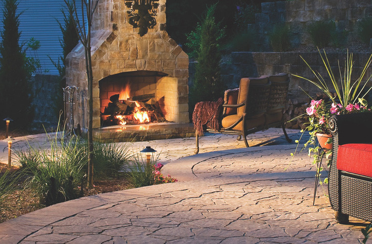 Inspiration for a medium sized mediterranean back patio in Indianapolis with a fire feature, natural stone paving and a pergola.