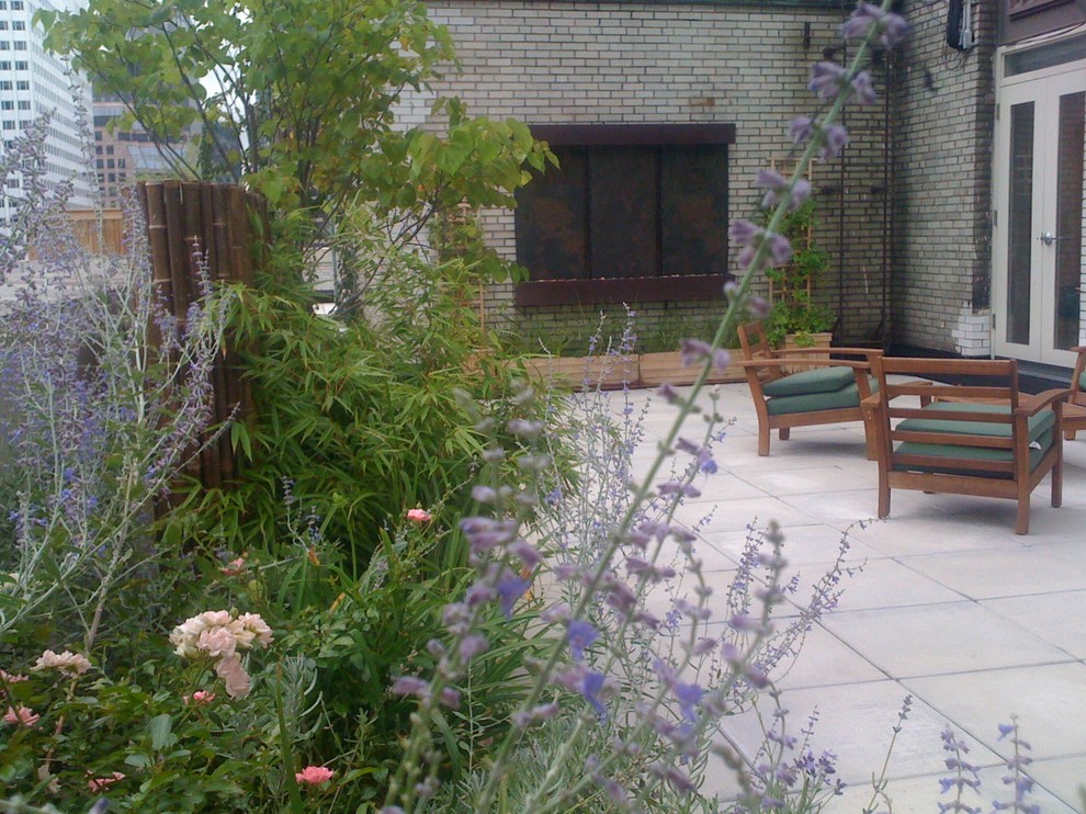 Patio container garden - large contemporary patio container garden idea in New York with no cover
