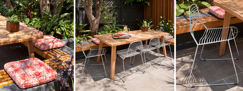 Inspiration for a medium sized modern back patio in Sydney with a fire feature, natural stone paving and no cover.