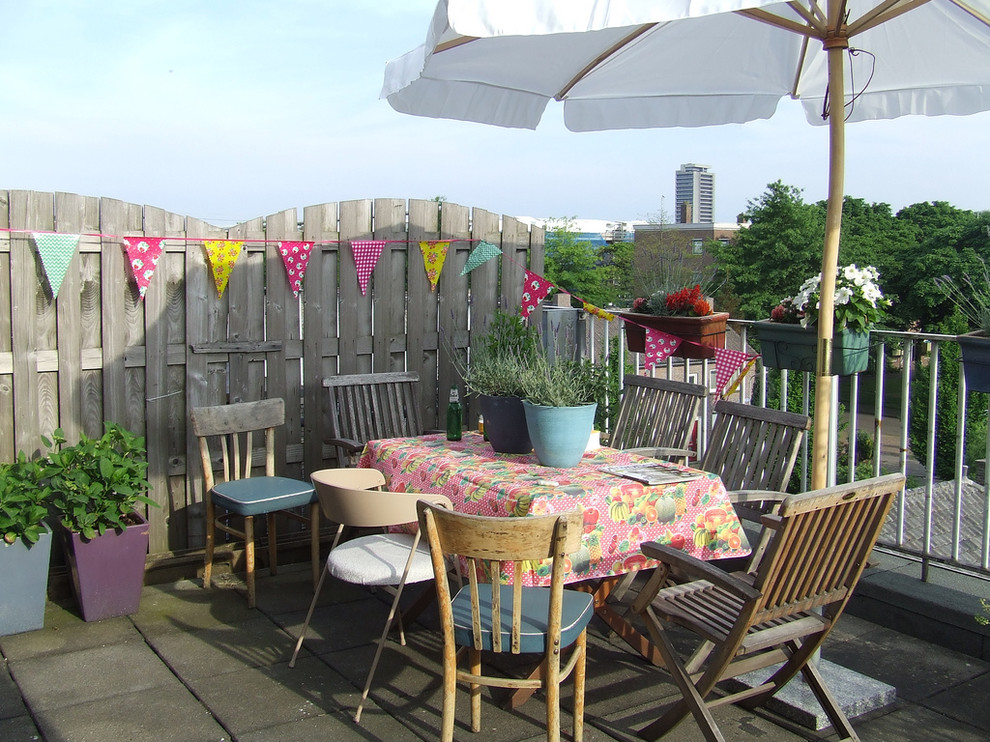 Inspiration for an eclectic patio remodel in Amsterdam with no cover