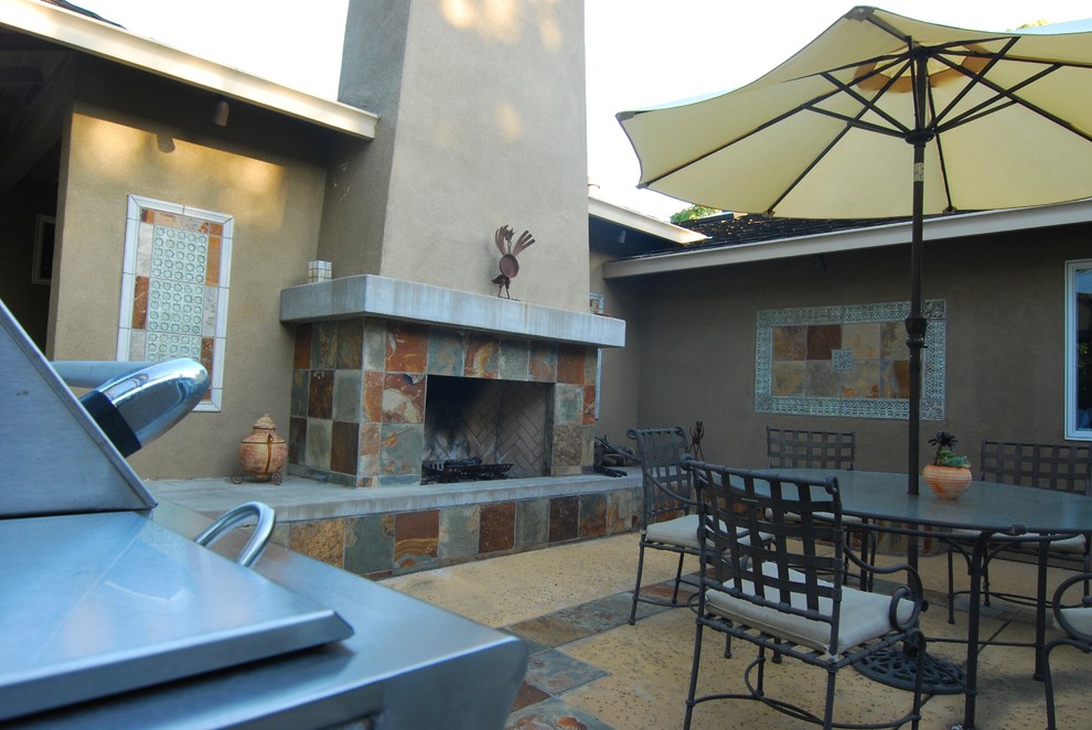 Mid-sized tuscan backyard patio kitchen photo in San Francisco with decking and no cover