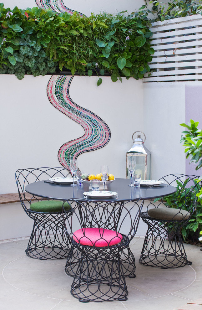 Patio - contemporary backyard patio idea in London with no cover