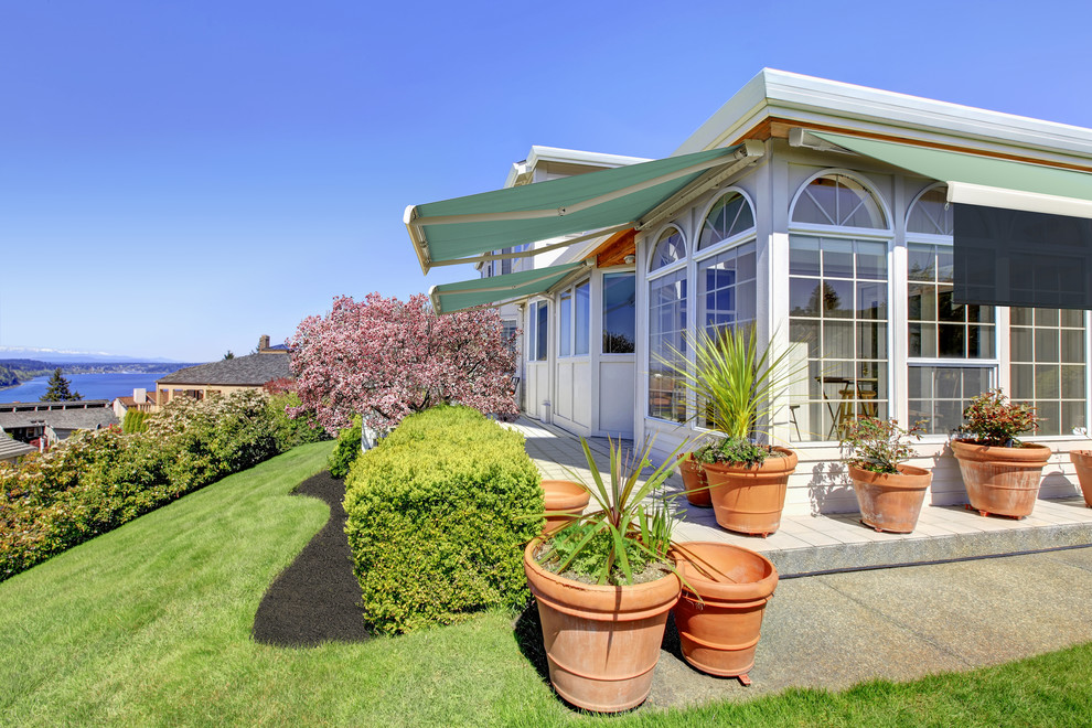 NuImage Pro K300 Retractable Awning provides cool shade on conservatory