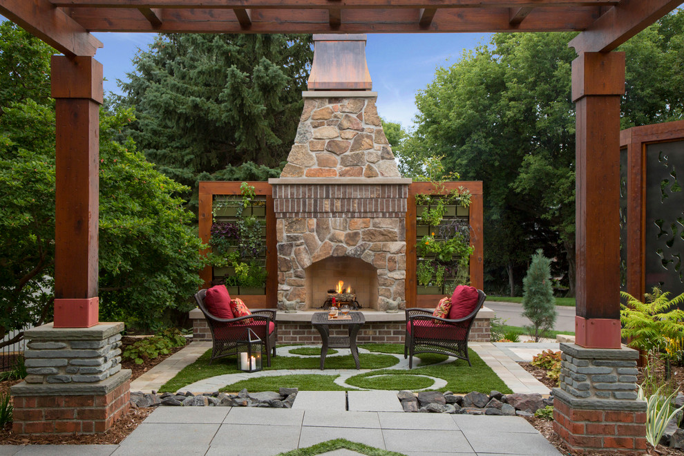 This is an example of a classic patio in Minneapolis with a fireplace.